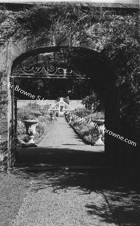 DUNSANY CASTLE GARDEN THROUGH GATE WITH VICTORIA DE RUTZEN AND 